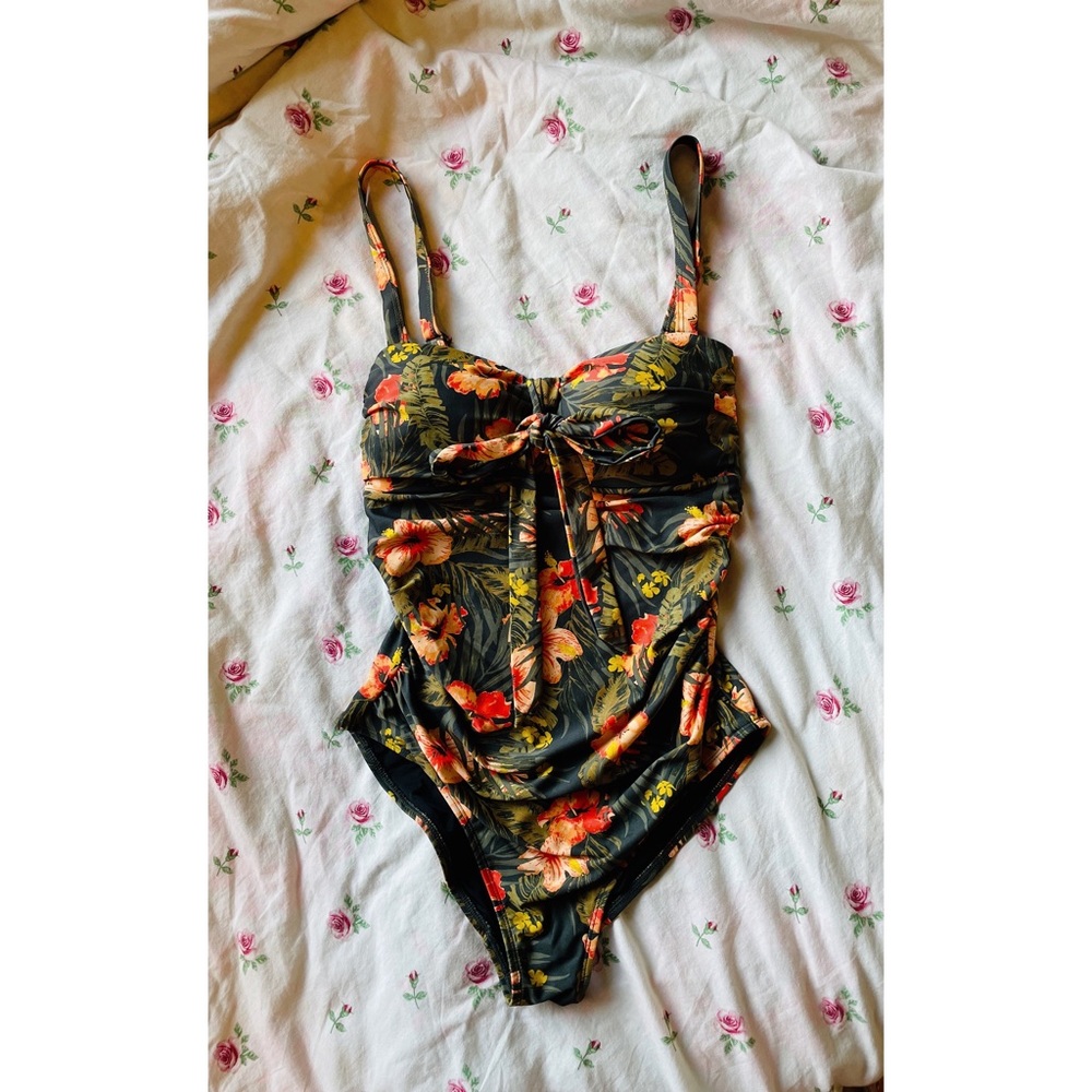 Floral swimsuit size: Medium Brand: Simon’s